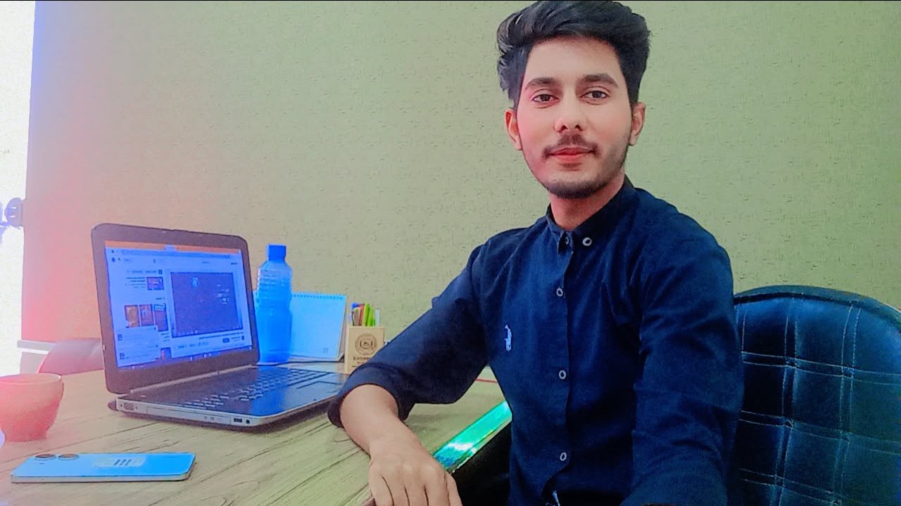 Ibrar Maqsood working at his laptop